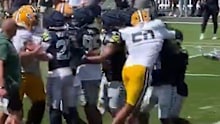Tom (50) throws a big punch during the brawl.