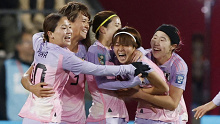 Japan players celebrate the own goal scored Norway's Ingrid Syrstad Engen in the first half.