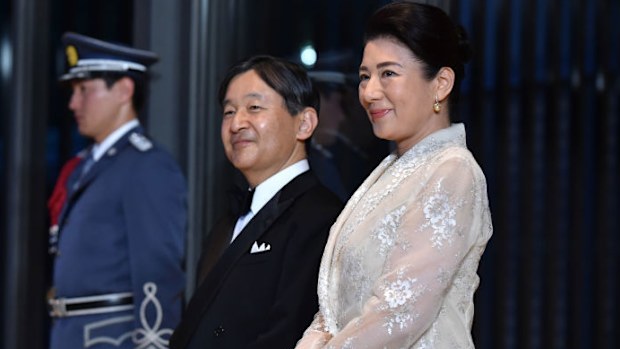 Japan's Emperor Naruhito (C) and Empress Masako (R) wait to greet US President Donald Trump and First Lady Melania Trump at the Imperial Palace for a state banquet  on May 27, 2019 