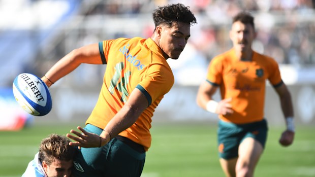 Jordan Petaia of Australia attempts to avoid a tackle.