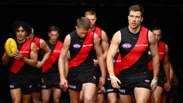 Zach Merrett leads his Bombers team out.