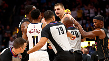 Markieff Morris #8 of the Miami Heat lays on the ground after being hit by Nikola Jokic #15 of the Denver Nuggets
