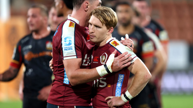 Connor Vest consoles Reds captain Tate McDermott after losing the Super Rugby Pacific quarter-final against the Chiefs in Hamilton.
