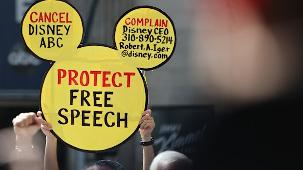 LOS ANGELES, CALIFORNIA - SEPTEMBER 22: A demonstrator holds a "Protect Free Speech" sign at a protest against the suspension of the "Jimmy Kimmel Live!" show, held near the theater where the show is produced in Hollywood, on September 22, 2025 in Los Angeles, California. A contingent of Hollywood union members, along with Democratic members of the House of Representatives, participated in the event "to defend Americans' constitutional right to free speech. Kimmel's ABC late-night show has been 