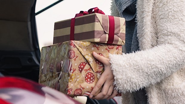 Christmas 2022 shopping placing gifts in car