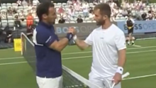 Fabio Fognini shakes hands with Corentin Moutet.