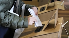 The AEC is investigating how missing ballot papers were found at an electoral worker's home. .(AP Photo/Mark Baker)