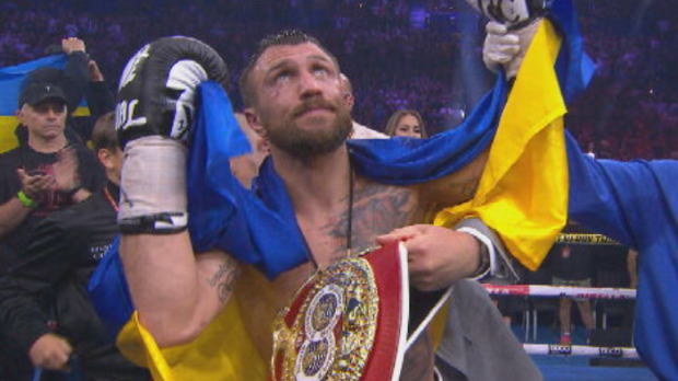 Lomachenko cleebrates his TKO win.