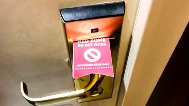 A sign on a cabin door on Pacific Explorer.