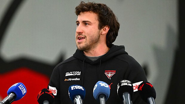 Andrew McGrath speaks to reporters about the sacking. 