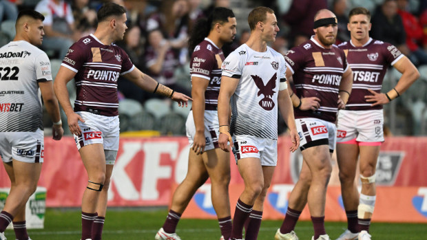 Matt Lodge (second from right) warms up with Manly Sea Eagles teammates prior to their round 22 match against St George Illawarra Dragons. 