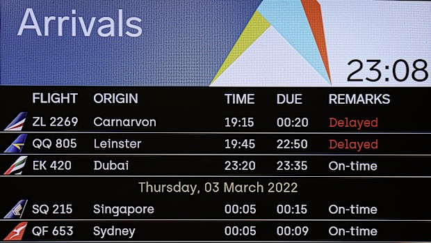 A flight arrivals board at the Perth International Airport Terminal showing the first flight in from Sydney.