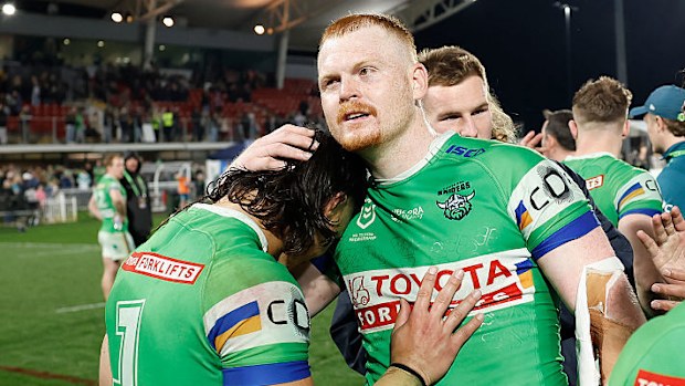 Corey Horsburgh of the Raiders embraces teammate Kaeo Weekes.