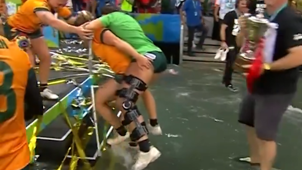 Demi Hayes rides a teammate to safety.