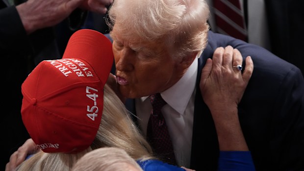 U.S. President Donald Trump kisses Rep. Marjorie Taylor Greene (R-GA) after addressing a joint session of Congress at the U.S. Capitol on March 04, 2025 in Washington, DC. President Trump was expected to address Congress on his early achievements of his presidency and his upcoming legislative agenda. 