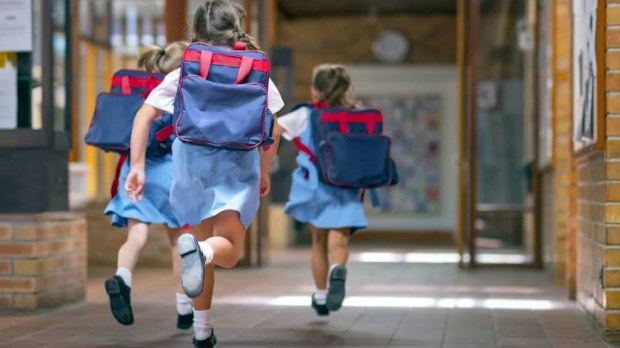 Parents have been warned against sharing photos of their kids' return to school on social media. Stock photos such as this one are careful to obscure identifying details.