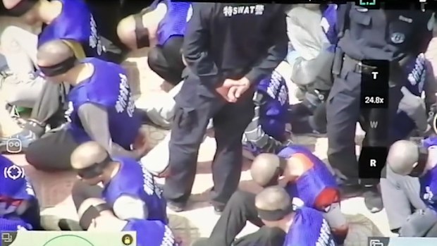 Disturbing video shows hundreds of blindfolded prisoners in China