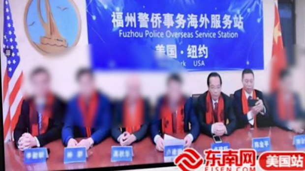 Lu Jianwang (third left) and Chen Jinping (second left) were arrested on Monday morning in New York. 