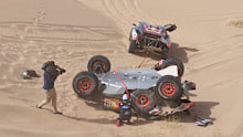 The car of Carlos Sainz after a rollover in the Dakar Rally.