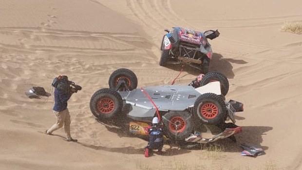 The car of Carlos Sainz after a rollover in the Dakar Rally.