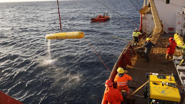 An autonomous underwater vehicle is recovered after completing a seafloor mapping mission in the Arctic Ocean. 