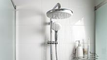Jets of clean water flowing in the shower cabin. Selective focus.