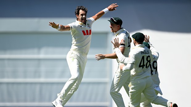 BRISBANE, AUSTRALIA - DECEMBER 04: Mitchell Starc of Australis celebrates dismissing Ben Duckett of England during day one of the Second 2025/26 Ashes Series Test Match between Australia and England at The Gabba on December 04, 2025 in Brisbane, Australia. (Photo by Gareth Copley/Getty Images)