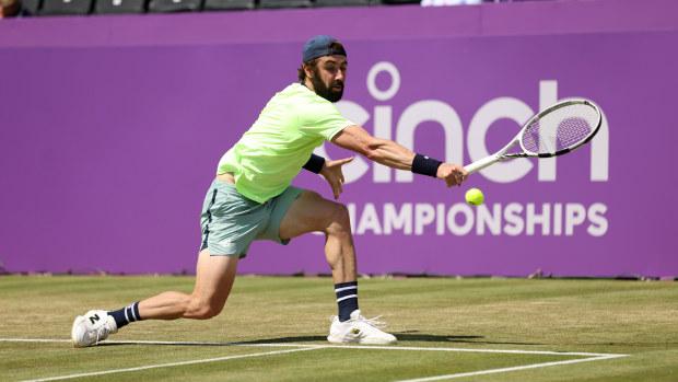 Jordan Thompson of Australia plays a backhand against Taylor Fritz of United States during the Men's Singles Quarter Final match on Day Five of the cinch Championships at The Queen's Club on June 21, 2024 in London, England.  (Photo by Luke Walker/Getty Images for LTA)