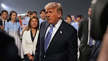 US President Donald Trump walks during a welcome ceremony as he arrives on Air Force One, on Wednesday, May 13, 2026, at Beijing Capital International Airport in Beijing.
