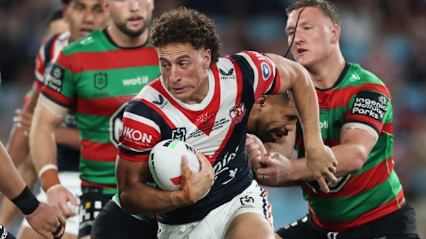 Mark Nawaqanitawase of the Roosters is tackled during the round 27 NRL match.
