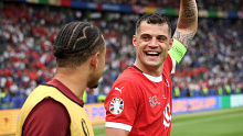 Granit Xhaka (right) celebrates victory over Italy.