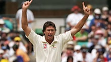 Glenn McGrath of Australia celebrates taking the wicket of Paul Collingwood of England.