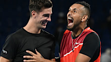 Thanasi Kokkinakis (L) and Nick Kyrgios (R) of Australia look on during their Men's Doubles First Round match at the 2022 Australian Open.