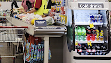 Customers wait in line at the check-out of the Coles Group Ltd. supermarket in the Elsternwick suburb of Melbourne, Australia, on Thursday, Feb. 11, 2021. Australian supermarket chain Coles is scheduled to announce earnings on Feb. 17. Photographer: Carla Gottgens/Bloomberg