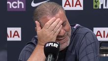 Ange Postecoglou reacts to a reporter's question.