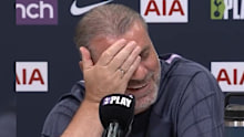 Ange Postecoglou reacts to a reporter's question.