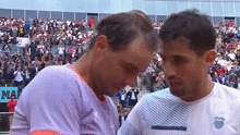 Pedro Cachin asks Nadal for his shirt.