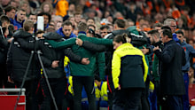 Staff members of Hungary during the medical emergency treatment of assistant trainer Adam Szalai.