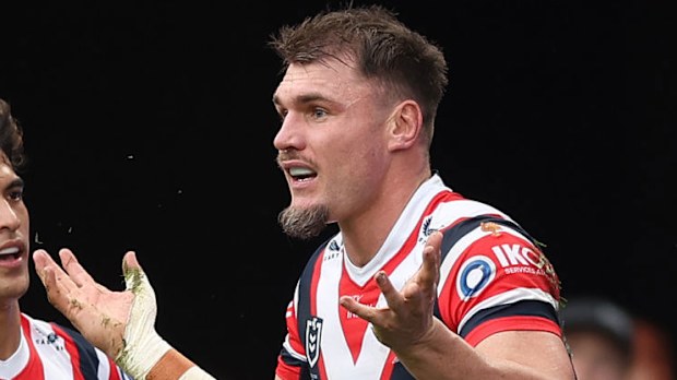 Angus Crichton celebrates scoring a try.