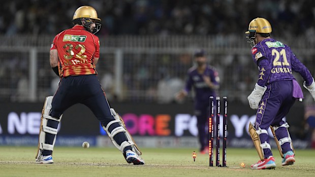 Punjab Kings' Glenn Maxwell looks back at his wicket after being bowled out by Kolkata Knight Riders' Varun Chakravarthy during the Indian Premier League cricket match between Kolkata Knight Riders and Punjab Kings at Eden Gardens in Kolkata in Kolkata , India, Saturday, April 26, 2025. (AP Photo/Bikas Das)