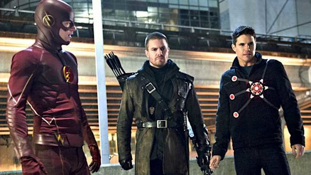 Grant Gustin as The Flash, Stephen Amell as Green Arrow and Robbie Amell as Firestorm on CW's hit superhero series