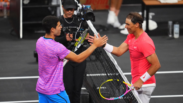 Carlos Alcaraz and Rafael Nadal at the net at the end of The Netflix Slam at Mandalay Bay Resort and Casino on March 3, 2024 in Las Vegas, Nevada. (Photo by Chris Unger)
