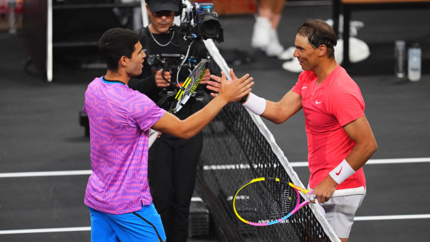 Carlos Alcaraz and Rafael Nadal at the net at the end of The Netflix Slam at Mandalay Bay Resort and Casino on March 3, 2024 in Las Vegas, Nevada. (Photo by Chris Unger)