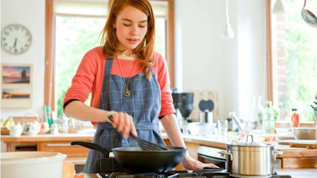 Lady cooking in her kitchen