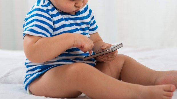 A baby with a smartphone