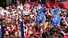 A big crowd gathers for the People's Parade ahead of the 2021 AFL Grand Final.