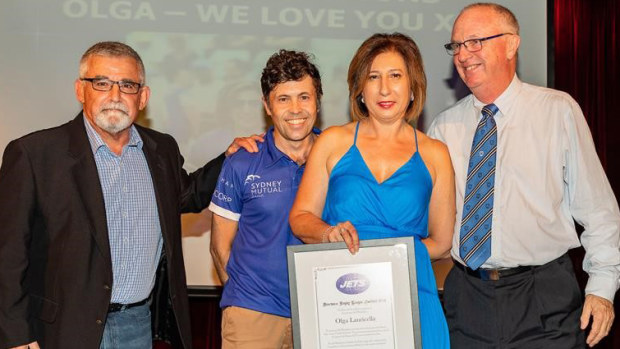 Olga Lauricella (second from right) receives her life membership at the Newtown Jets.