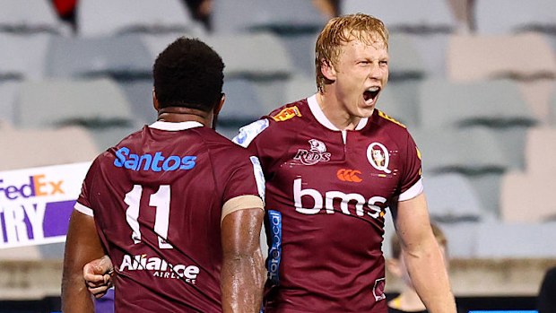 Carter Gordon of the Reds celebrates scoring a try to win the Super Rugby match.