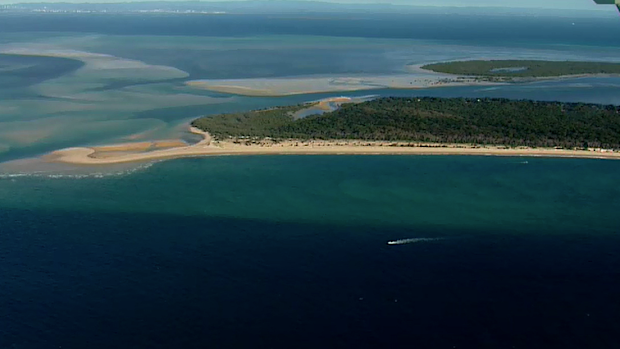 The pair took on water after travelling through dangerous conditions near north Stradbroke Island. 