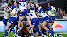 The Bulldogs go berserk in celebration of Stephen Crichton's match-winning field goal in golden point.